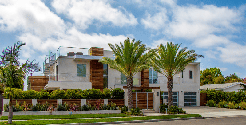 California home front yard landscape with succulent garden and date palm trees