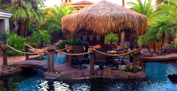 layered tropical landscape with poolside pergola